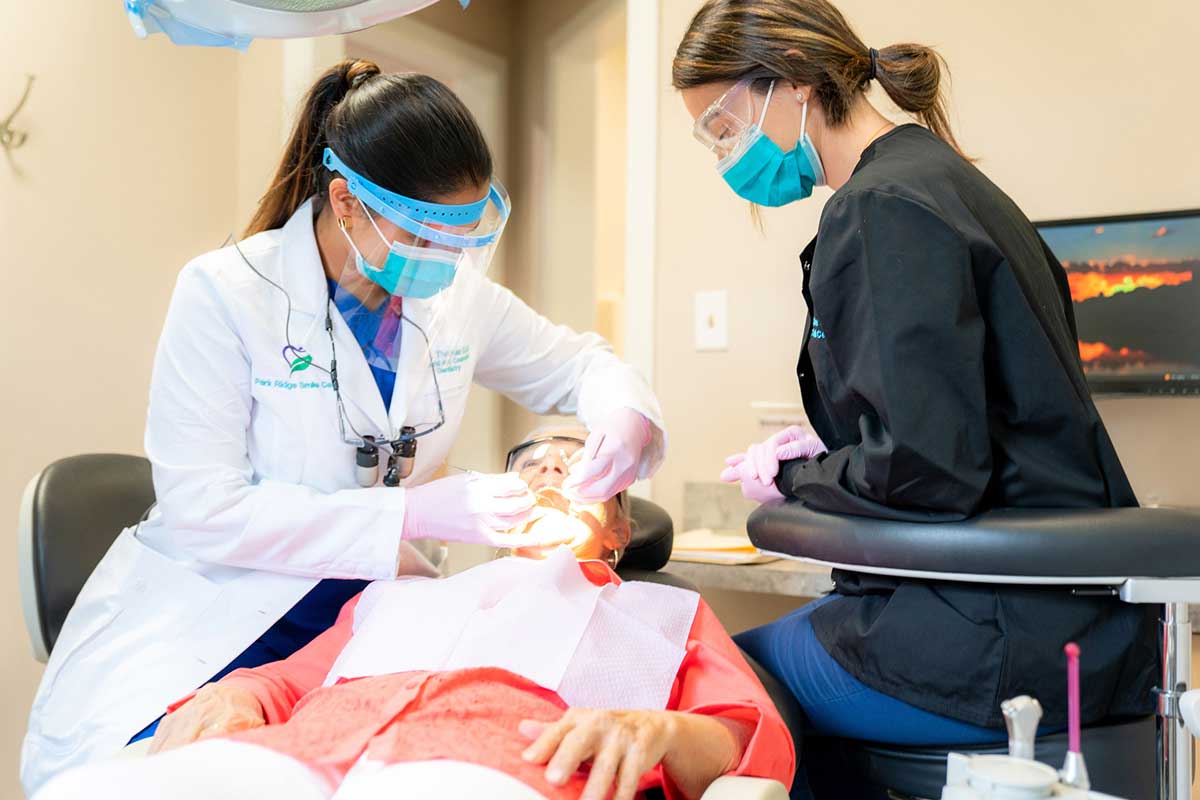 Dr. Susan Thomas providing dental care for a patient at Park Ridge Smile Center