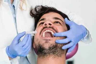 man being fitted for Invisalign in Park Ridge, IL