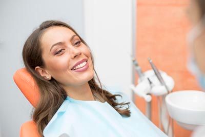 woman smiling during her cosmetic dentistry appointment