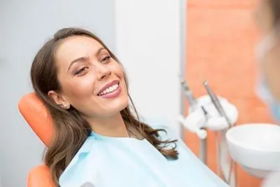 woman smiling during her cosmetic dentistry appointment