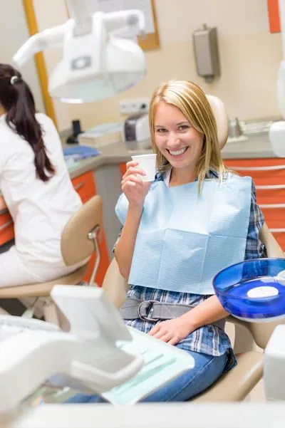 woman smiling before her dental procedure